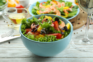 Concept of tasty eating with shrimp salad, close up