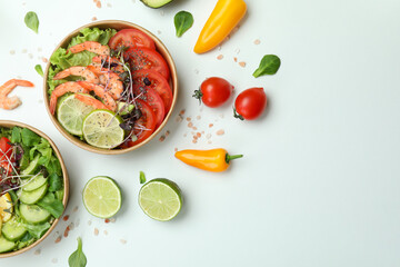 Concept of tasty eating with shrimp salads on white background