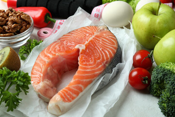 Healthy nutrition concept on white textured background, close up