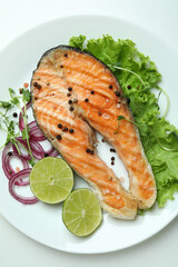 Concept of tasty eating with grilled salmon on white background