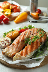Concept of tasty eating with grilled salmon, close up