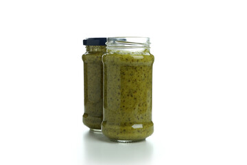 Jars of Pesto sauce isolated on white background