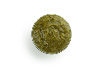 Bowl of Pesto sauce isolated on white background