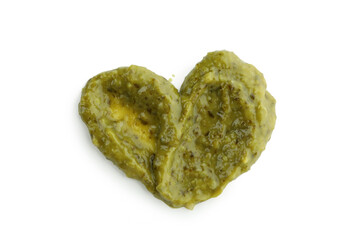 Pesto sauce in heart shape isolated on white background