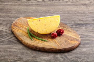 Hard cheese brick with walnut