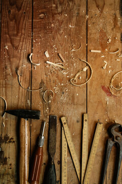 Top view at the wooden table with carpentery tools in workshop	