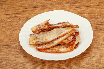 Roasted juicy bacon in the plate