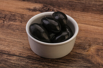 Pickled black olives in the bowl