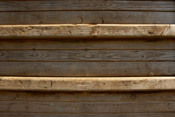 textured and worn wooden slats of a childrens climbing frame