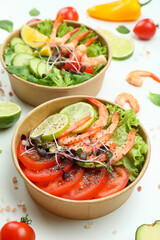 Concept of tasty eating with shrimp salads on white background