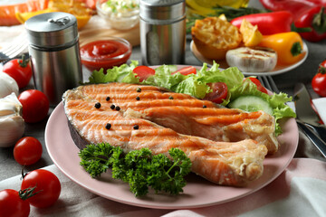 Concept of tasty eating with grilled salmon, close up