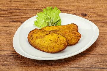 Baked potato with herbs and spices