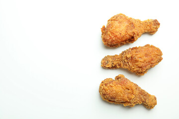 Tasty fried chicken on white background, space for text
