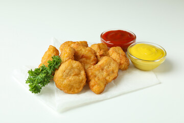 Concept of tasty eating with fried chicken on white background