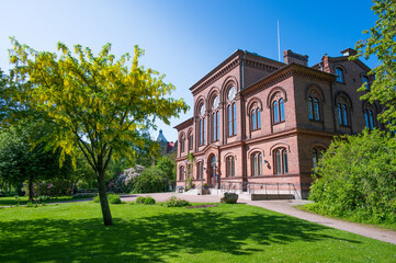 One of the historic university buildings in a beautiful garden in Lund Sweden