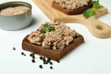 Tasty tuna sandwiches on white background, close up