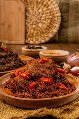 Rendang Pork or Rendang babi. 

Rendang babi is often described as a rich dish of meat  that has been slow cooked and braised in a coconut milk seasoned with a herb and spice mixture.
