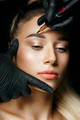Cosmetician in gloves doing permanent makeup - obrazy, fototapety, plakaty
