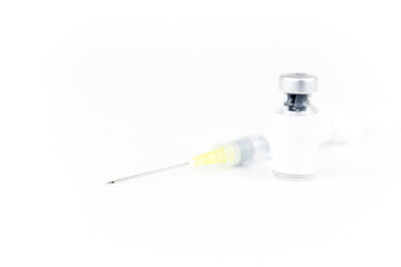 medicine bottle empty space label for text and syringe needle injected on white background. medical and treatment concept