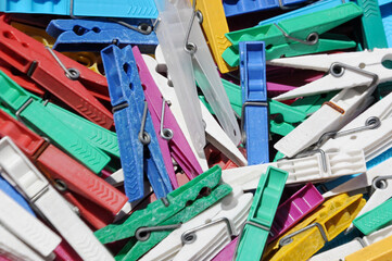 Bunch of colorful clothespins in a box