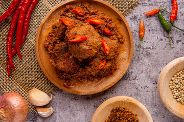 Rendang Pork or Rendang babi. 

Rendang babi is often described as a rich dish of meat  that has been slow cooked and braised in a coconut milk seasoned with a herb and spice mixture.