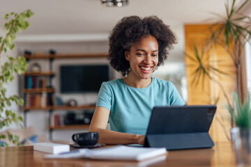 Adult African woman, enjoying her conversation, online.