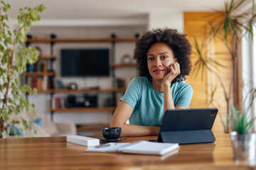 Adult African woman, relaxing after a hard day at work.