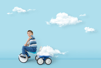 Concept of freedom mind success hope ambition and dream. Clouds creator, surreal concept. Boy...
