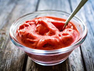 Strawberry ice cream on wooden background
