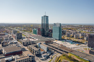Almere city center, aerial view on the train station and highrise corporate office buildings. Flevoland, The Netherlands.