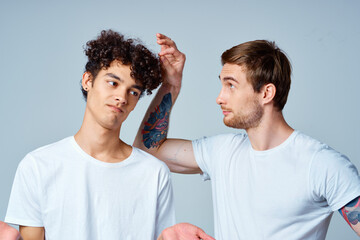 emotional two friends in white t-shirts yes fun studio