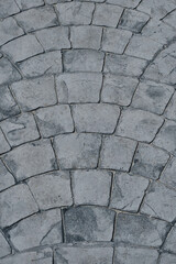 Stone block pavement. Gray paving slabs, close up. Pattern of paving blocks, top view