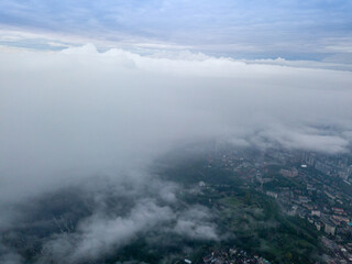 View of Kiev above the clouds at dawn. Aerial drone view.