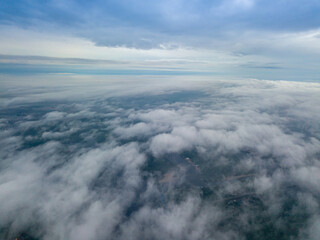 View of Kiev above the clouds at dawn. Aerial drone view.