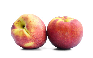 Two whole peaches isolated on white background