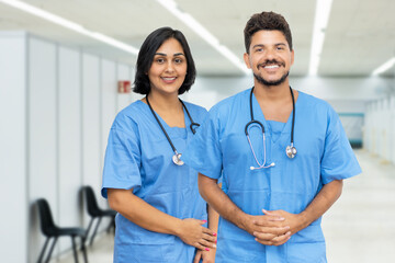 Beautiful latin american male and female nurses at vaccination station