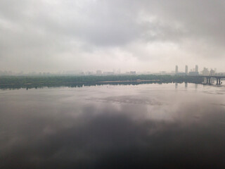 Dnieper river on a cloudy morning. Aerial drone view.