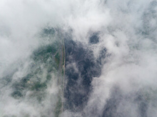 High view of the Dnieper River in Kiev. Aerial high flight above the clouds.