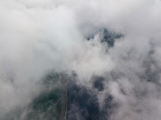 High view of the Dnieper River in Kiev. Aerial high flight above the clouds.