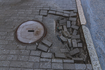 Repair of failed paving slabs. Sagging paving slabs