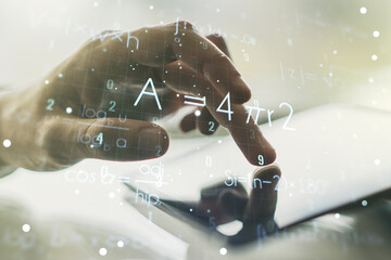 Double exposure of creative scientific formula concept with finger clicks on a digital tablet on background, research and development concept