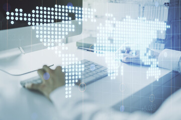 Multi exposure of abstract creative digital world map and hand typing on computer keyboard on background, research and analytics concept