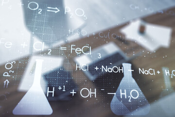 Double exposure of creative chemistry concept and modern desktop with laptop on background, research and development concept