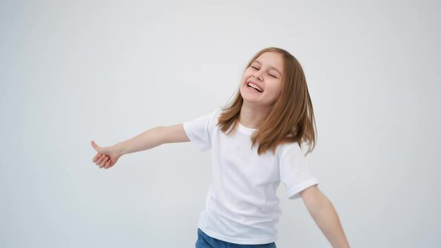 Cute little girl is very happy, showing thumbs up
