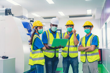 Male industrial engineer or technician worker using control machine operating control CNC machinery at factory Industrial.