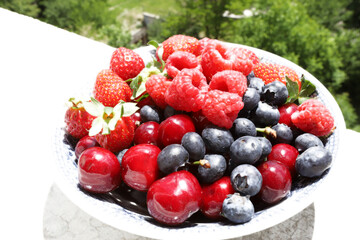 Fresh fruits and berries on daylight