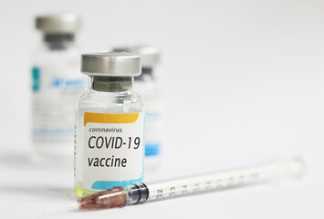 COVID-19 vaccine concept with white background and syringe injection, protective from novel coronavirus 2019.