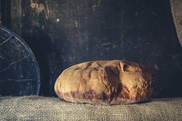 Appetizing crunchy crust bread isolated on woody backgrounds. 