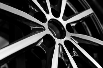 Obraz na płótnie Canvas Black alloy wheels for premium cars, close-up. Purchase and replacement of autodisks
