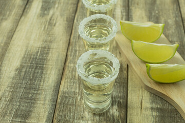 Tequila in a glass with salt and lime